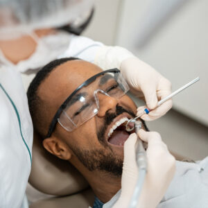 A male patient getting a dental checkup at Hamilton Family Dentistry