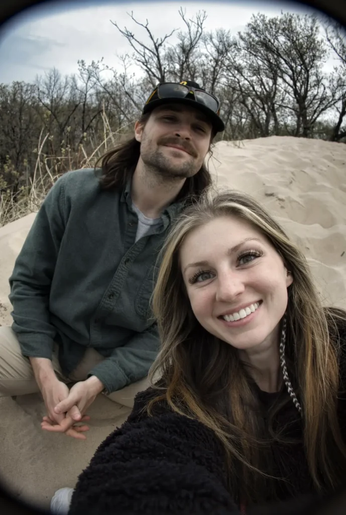 Dr. Sydney Nolan and her husband smiling for the camera outdoors.